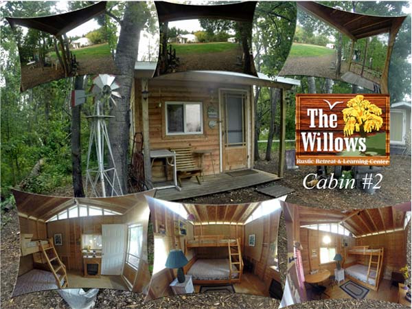 Small wooden cabin with images of bunkbeds inside, fireplace, and plastic table and chair.